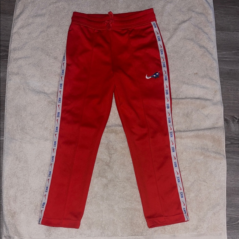 Nike Woman’s Red Joggers with Side Stripes
